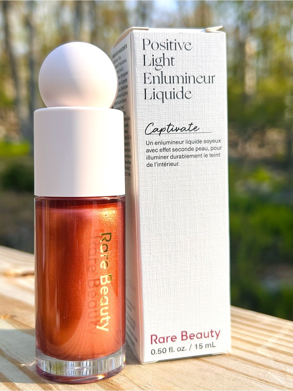 Rare Beauty Positive Light Liquid Luminizer — Captivate (copper shimmer)